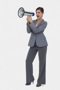 Businesswoman with loudspeaker