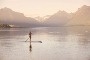 Woman on canoe, Lake McDonald, Glacier National Park, Montana, USA